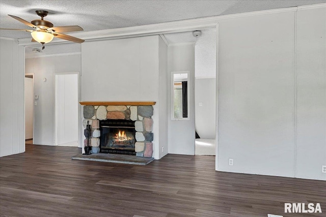 913 Springfield St, Kincaid, IL 62540 - unfurnished living room featuring ornamental molding, wood finished floors, a stone fireplace, a ceiling fan, and a textured ceiling
