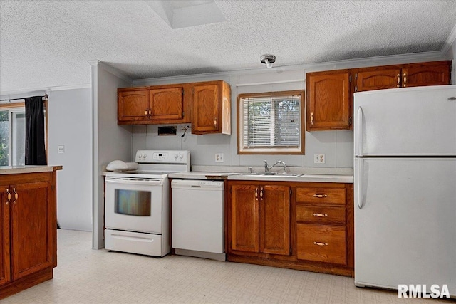 913 Springfield St, Kincaid, IL 62540 - kitchen with white appliances, crown molding, a textured ceiling, light countertops, and healthy amount of natural light