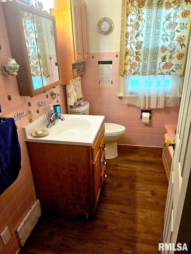 707 E Clark St, Litchfield, IL 62056 - bathroom featuring tile walls, wood finished floors, and vanity