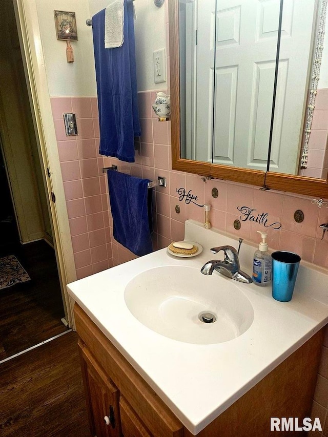 707 E Clark St, Litchfield, IL 62056 - bathroom with vanity, wood finished floors, and tile walls