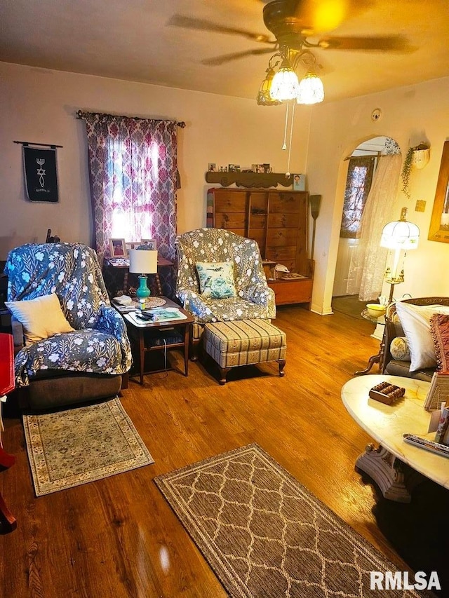 707 E Clark St, Litchfield, IL 62056 - living room with a ceiling fan, wood finished floors, and arched walkways