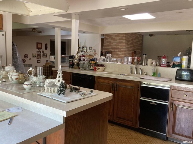 604 Knox Rd N Unit 1000, Gilson, IL 61436 - kitchen featuring black dishwasher, light countertops, a ceiling fan, and light flooring