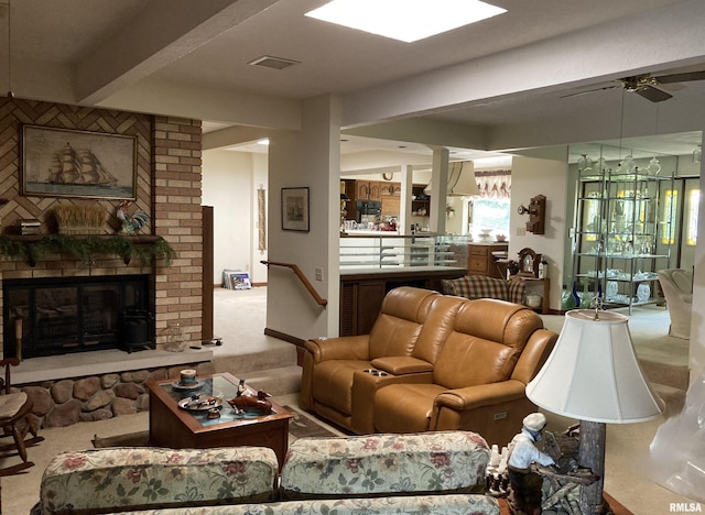 604 Knox Rd N Unit 1000, Gilson, IL 61436 - carpeted living room featuring a fireplace and ceiling fan