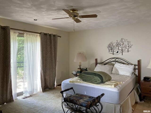 604 Knox Rd N Unit 1000, Gilson, IL 61436 - bedroom with light colored carpet and ceiling fan