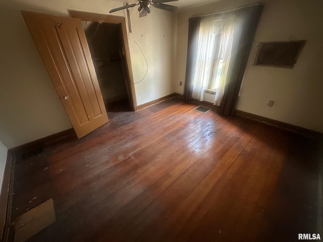 544 W Tompkins St, Galesburg, IL 61401 - unfurnished bedroom with wood-type flooring and baseboards