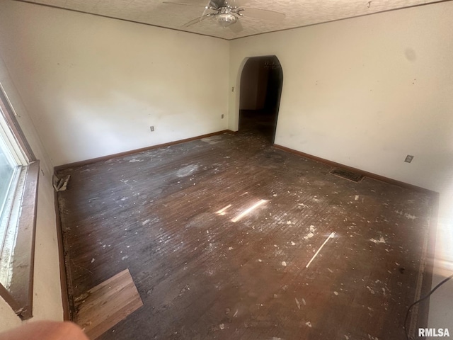 544 W Tompkins St, Galesburg, IL 61401 - spare room with arched walkways and a ceiling fan