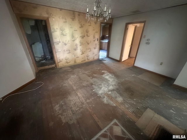 544 W Tompkins St, Galesburg, IL 61401 - unfurnished dining area with baseboards and a chandelier