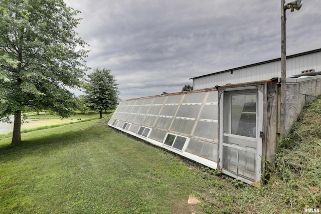 1784 N 2700th Ave, Loraine, IL 62349 - view of grassy yard with a greenhouse and an outbuilding
