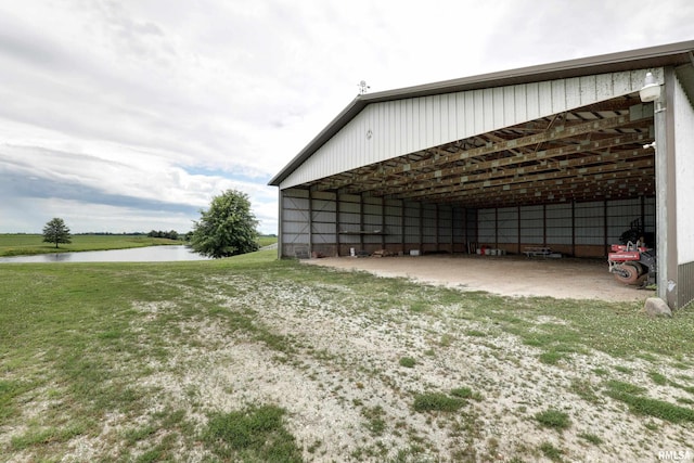 1784 N 2700th Ave, Loraine, IL 62349 - garage featuring a water view, a carport, and driveway