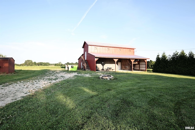 42060 County Highway 10, Nebo, IL 62355 - rear view of house featuring an outdoor structure, a yard, a barn, and driveway