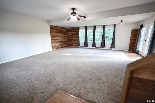 42060 County Highway 10, Nebo, IL 62355 - carpeted spare room with plenty of natural light, ceiling fan, and wooden walls