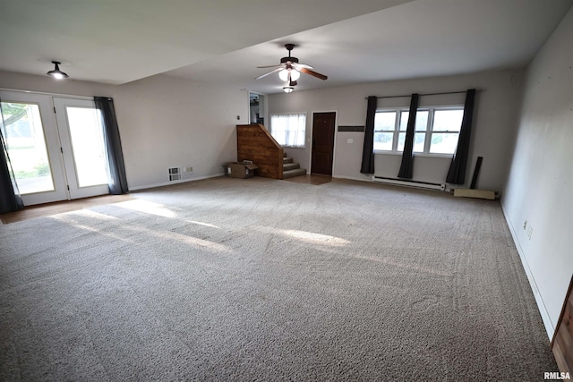 42060 County Highway 10, Nebo, IL 62355 - unfurnished living room with a baseboard heating unit, carpet floors, stairway, and ceiling fan