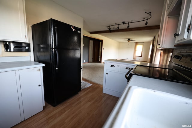 42060 County Highway 10, Nebo, IL 62355 - kitchen with black appliances, white cabinetry, wood finished floors, ceiling fan, and a peninsula