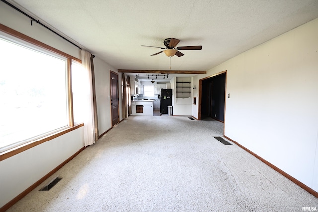 42060 County Highway 10, Nebo, IL 62355 - unfurnished living room featuring ceiling fan and light colored carpet