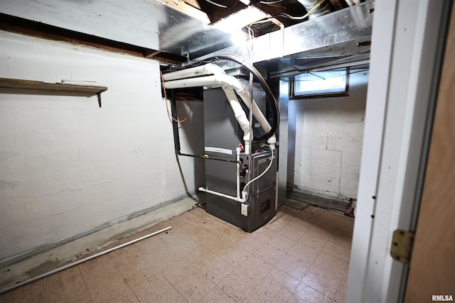 42060 County Highway 10, Nebo, IL 62355 - below grade area featuring heating unit, tile patterned floors, and concrete block wall
