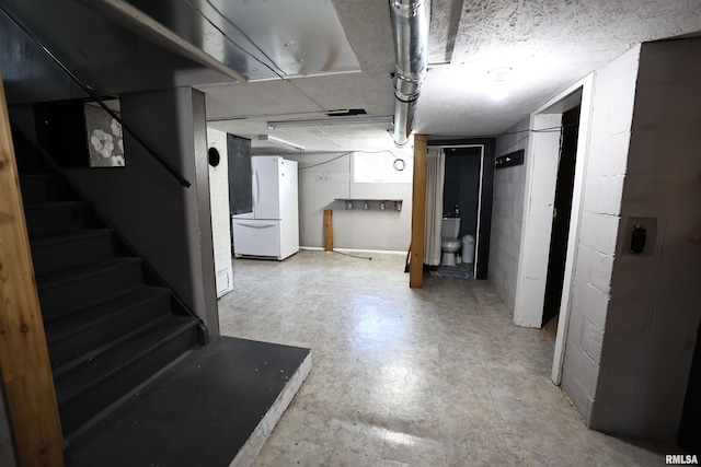 42060 County Highway 10, Nebo, IL 62355 - finished below grade area featuring freestanding refrigerator, tile patterned floors, stairway, and concrete block wall