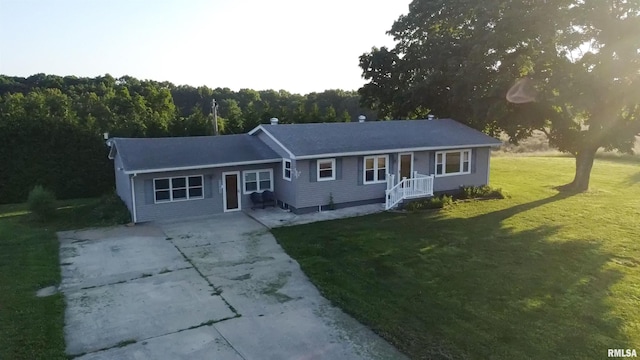 42060 County Highway 10, Nebo, IL 62355 - view of front of property featuring concrete driveway, a front lawn, and a wooded view