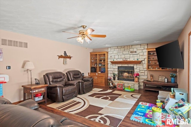 1420 Weston Pointe Dr, Springfield, IL 62704 - living room with ceiling fan, wood finished floors, and a stone fireplace