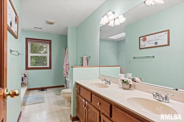 1420 Weston Pointe Dr, Springfield, IL 62704 - bathroom featuring double vanity and a skylight