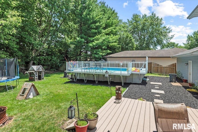 1420 Weston Pointe Dr, Springfield, IL 62704 - fenced backyard featuring a trampoline and a wooden deck