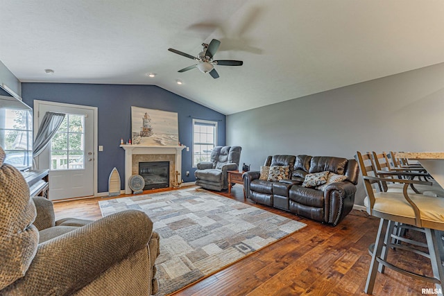 3 Megan Ct, Bloomington, IL 61705 - living room featuring lofted ceiling, ceiling fan, wood-type flooring, and a glass covered fireplace