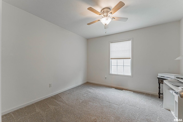 3 Megan Ct, Bloomington, IL 61705 - spare room with ceiling fan and light colored carpet