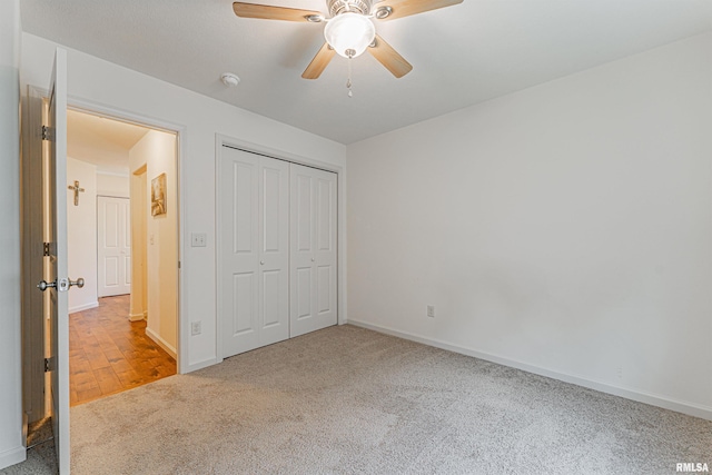 3 Megan Ct, Bloomington, IL 61705 - unfurnished bedroom with carpet, a closet, and a ceiling fan
