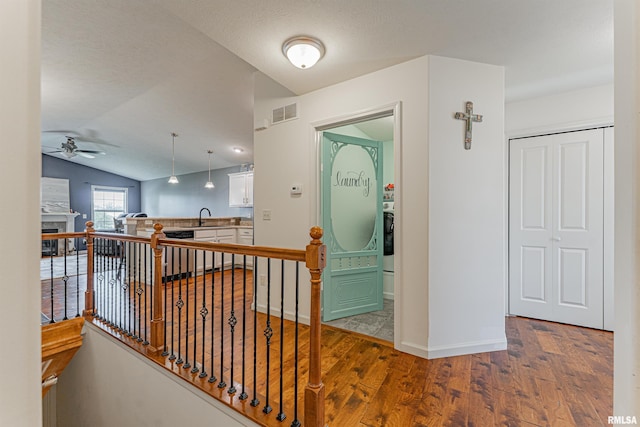 3 Megan Ct, Bloomington, IL 61705 - corridor featuring wood finished floors, an upstairs landing, and vaulted ceiling