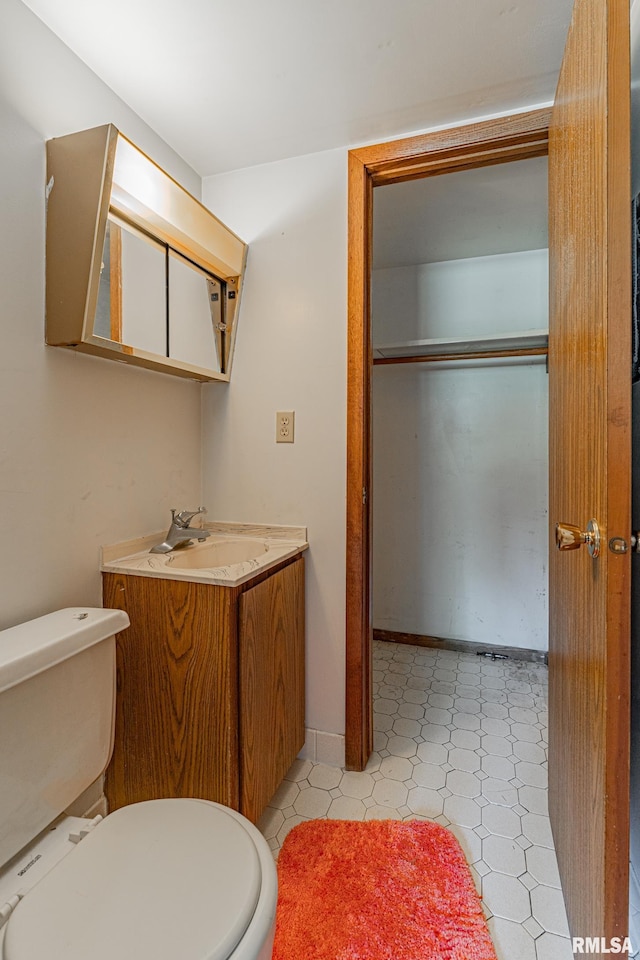 913 N Flora Dr, Mount Pulaski, IL 62548 - bathroom featuring vanity and tile patterned floors