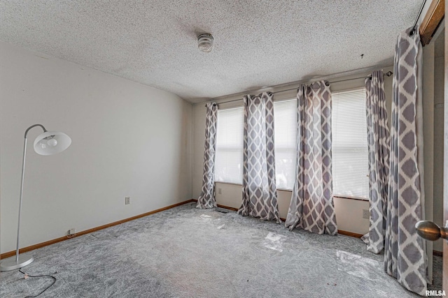 913 N Flora Dr, Mount Pulaski, IL 62548 - carpeted spare room featuring a textured ceiling and a smoke detector