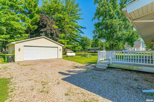 913 N Flora Dr, Mount Pulaski, IL 62548 - view of yard with an outbuilding, a garage, and a wooden deck