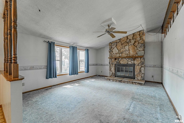 913 N Flora Dr, Mount Pulaski, IL 62548 - unfurnished living room featuring a ceiling fan, lofted ceiling, a textured ceiling, carpet floors, and a fireplace