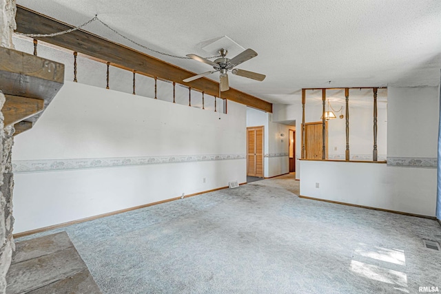 913 N Flora Dr, Mount Pulaski, IL 62548 - carpeted spare room with a ceiling fan, vaulted ceiling, and a textured ceiling