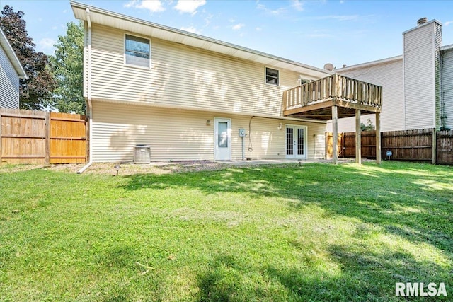 913 Diane Ct, Springfield, IL 62702 - back of property featuring french doors, a wooden deck, and a fenced backyard