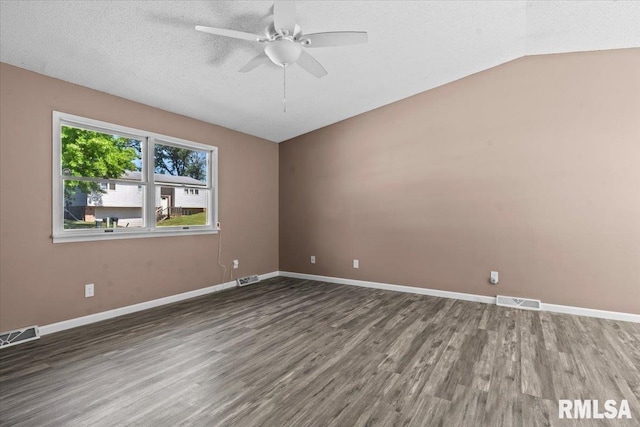 913 Diane Ct, Springfield, IL 62702 - empty room featuring wood finished floors, ceiling fan, vaulted ceiling, and a textured ceiling