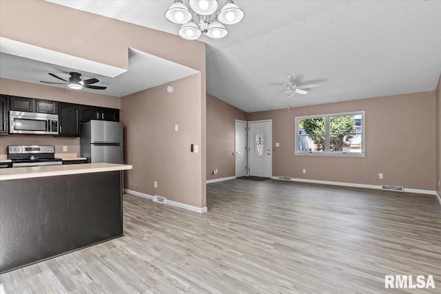 913 Diane Ct, Springfield, IL 62702 - kitchen featuring stainless steel appliances, a ceiling fan, light countertops, light wood finished floors, and lofted ceiling