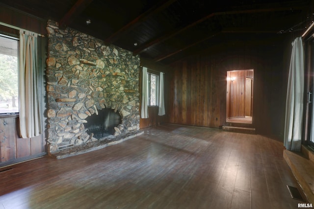 1220 Springdale S Dr, Quincy, IL 62305 - unfurnished living room with wood finished floors, plenty of natural light, wooden walls, a stone fireplace, and wood ceiling
