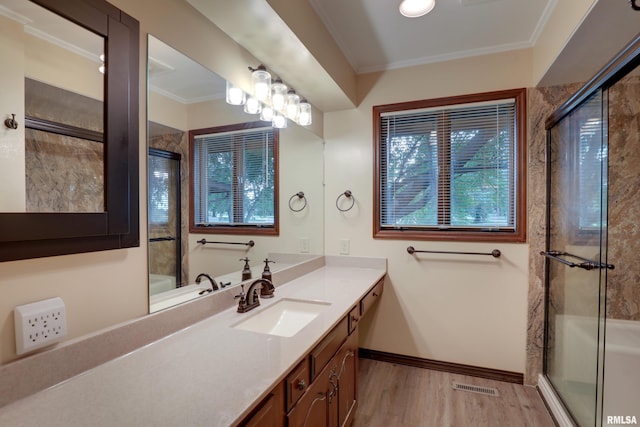 1220 Springdale S Dr, Quincy, IL 62305 - full bath with crown molding, wood finished floors, a shower with shower door, and vanity
