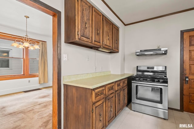 417 E Keys Ave, Springfield, IL 62702 - kitchen with stainless steel gas range oven, under cabinet range hood, ornamental molding, a chandelier, and light countertops