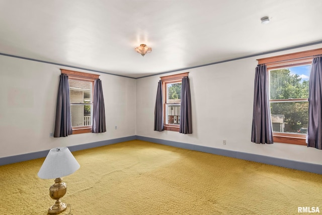 417 E Keys Ave, Springfield, IL 62702 - carpeted empty room with plenty of natural light and a smoke detector
