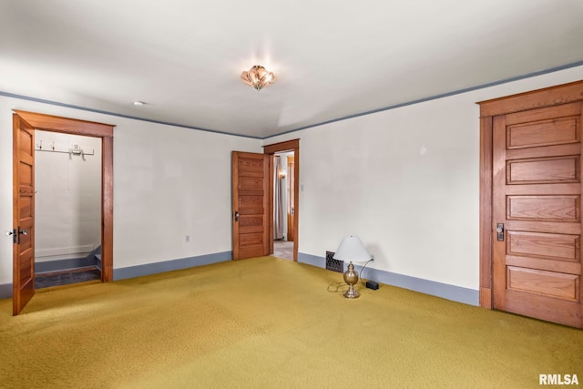 417 E Keys Ave, Springfield, IL 62702 - unfurnished bedroom featuring light carpet and baseboards