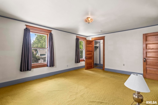 417 E Keys Ave, Springfield, IL 62702 - unfurnished room with plenty of natural light, carpet floors, and ornamental molding