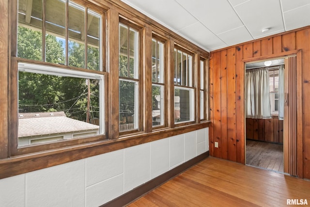 417 E Keys Ave, Springfield, IL 62702 - empty room featuring hardwood / wood-style flooring, wooden walls, and a smoke detector
