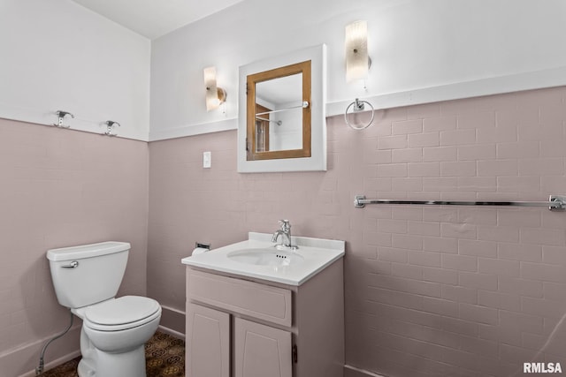 417 E Keys Ave, Springfield, IL 62702 - bathroom with vanity, tile walls, and a wainscoted wall