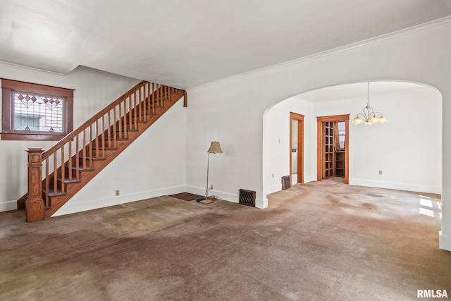 417 E Keys Ave, Springfield, IL 62702 - unfurnished living room with arched walkways, a chandelier, stairway, carpet floors, and ornamental molding