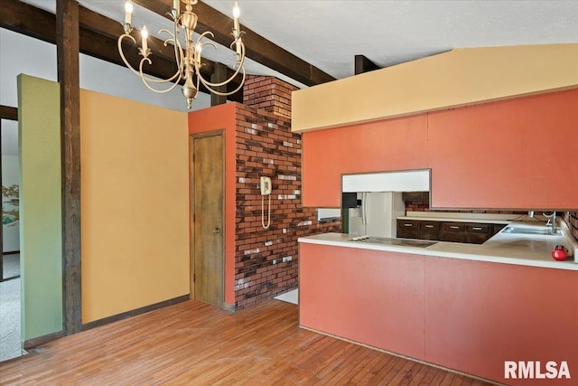 5016 Kinsinger Ln, Pleasant Plains, IL 62677 - kitchen with fridge with ice dispenser, light wood-style flooring, a chandelier, black electric stovetop, and light countertops