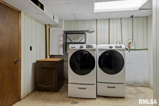 5016 Kinsinger Ln, Pleasant Plains, IL 62677 - washroom featuring independent washer and dryer, wood walls, and light floors