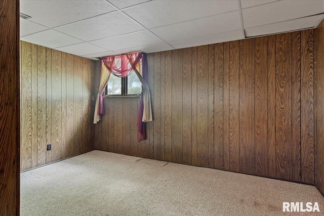 5016 Kinsinger Ln, Pleasant Plains, IL 62677 - empty room featuring a drop ceiling, carpet, and wood walls