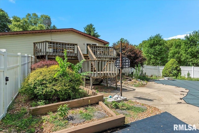 5016 Kinsinger Ln, Pleasant Plains, IL 62677 - fenced backyard featuring stairway, a deck, a garden, and a patio area