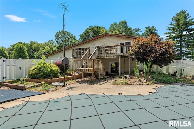 5016 Kinsinger Ln, Pleasant Plains, IL 62677 - rear view of house featuring stairway, a fenced backyard, a deck, and a patio area